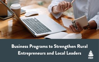 Graphics with image of person at desk with laptop and notes with text "Business Programs to Strengthen Rural Entrepreneurs and Local Leaders"
