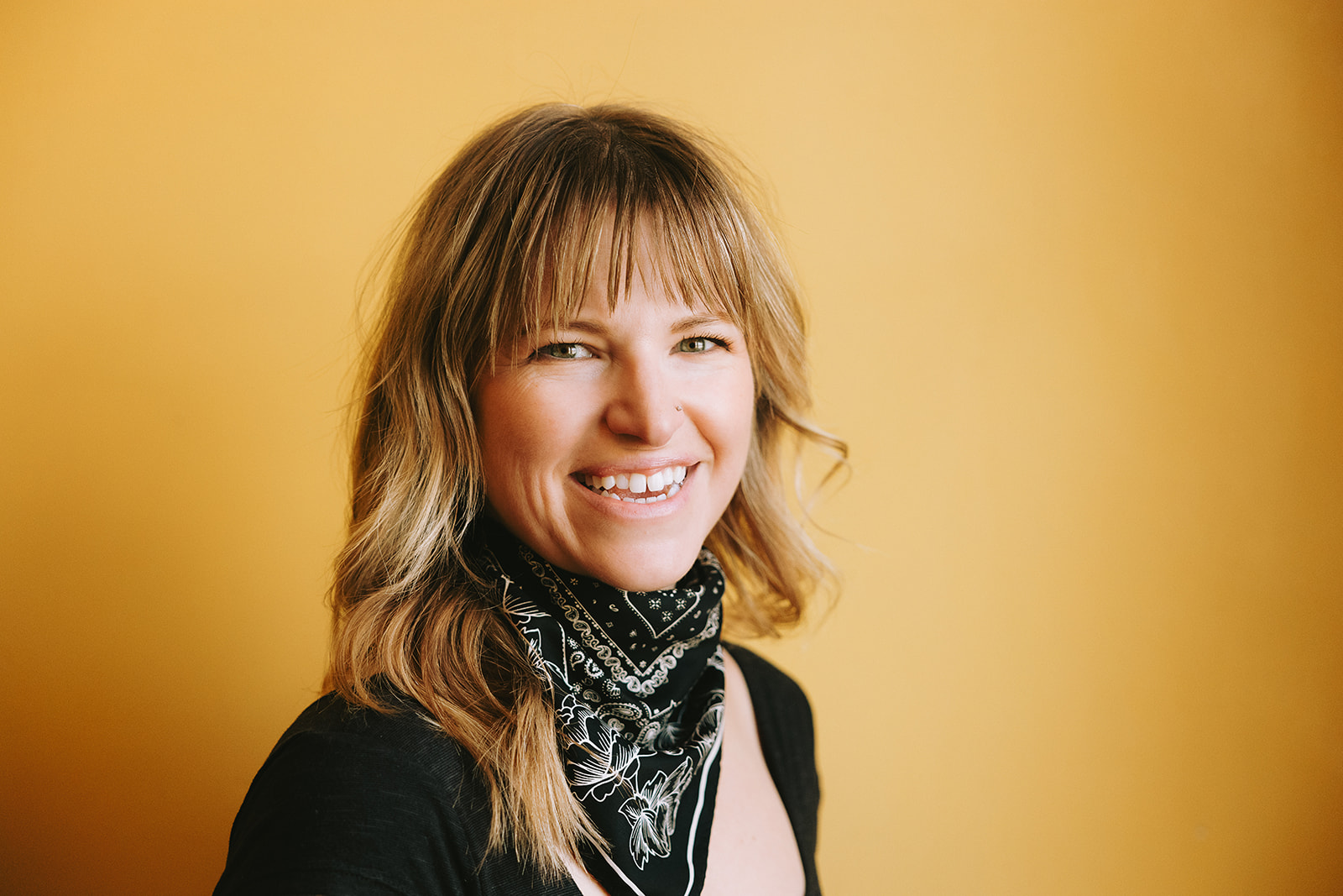 Portrait of a women with an orange background